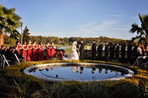 Couple being married outside behing pond at Rosen Shingle Creek