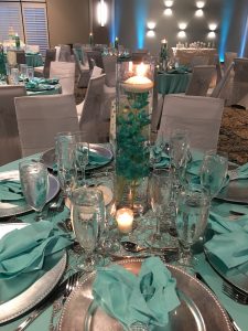 Wedding Reception Table with Green napkins and glassware