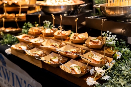 Catering samples on display at a wedding expo.