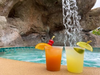 Two drinks resting poolside at Rosen Plaza during an Orlando winter vacation.