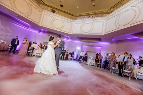 A bride and groom sharing a dance in an indoor wedding reception venue in Orlando.