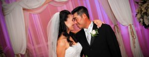 Asian bride and groom face to face smiling