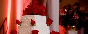 White cake with red roses