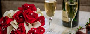 Flowers, champagne, chocolate covered strawberries