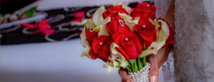 Brides Boquet with Red and White Flowers Wrapped in Pearls