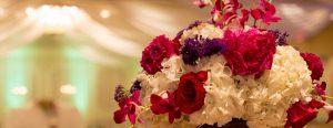 White, red, purple, and pink flowers in vase