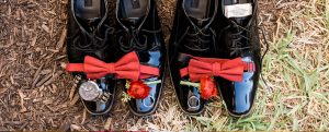 Grooms Shoes with watch, rings, amd bow tie on top