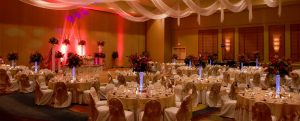 Wedding Reception with White Table cloths and flower center pieces