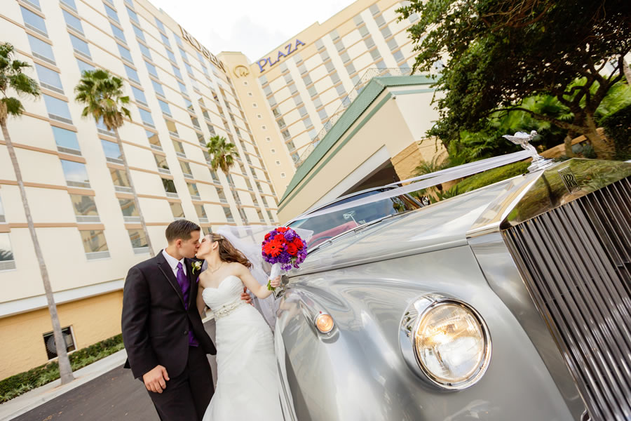 Newlyweds Kissing in front of Rosen Plaza