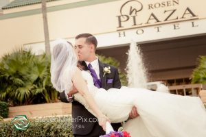 Newlyweds Kissing in front of Rosen Plaza
