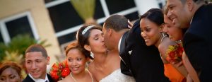 Wedding Party outside surrounding bride and groom